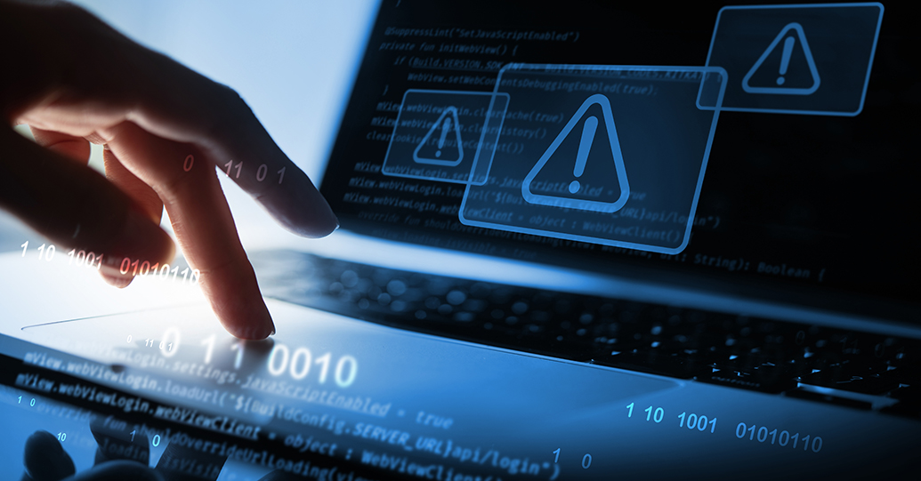Cyber security concept. Man using computer with system hacked alert due to cyber attack on computer network. Data Protection. Internet virus cyber security and cybercrime