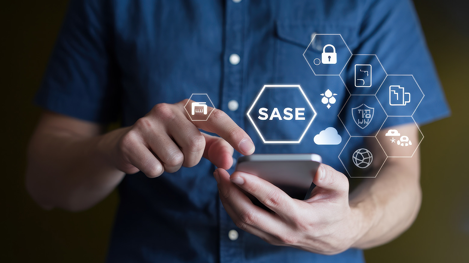Person holding a phone beneath a SASE label and security icons