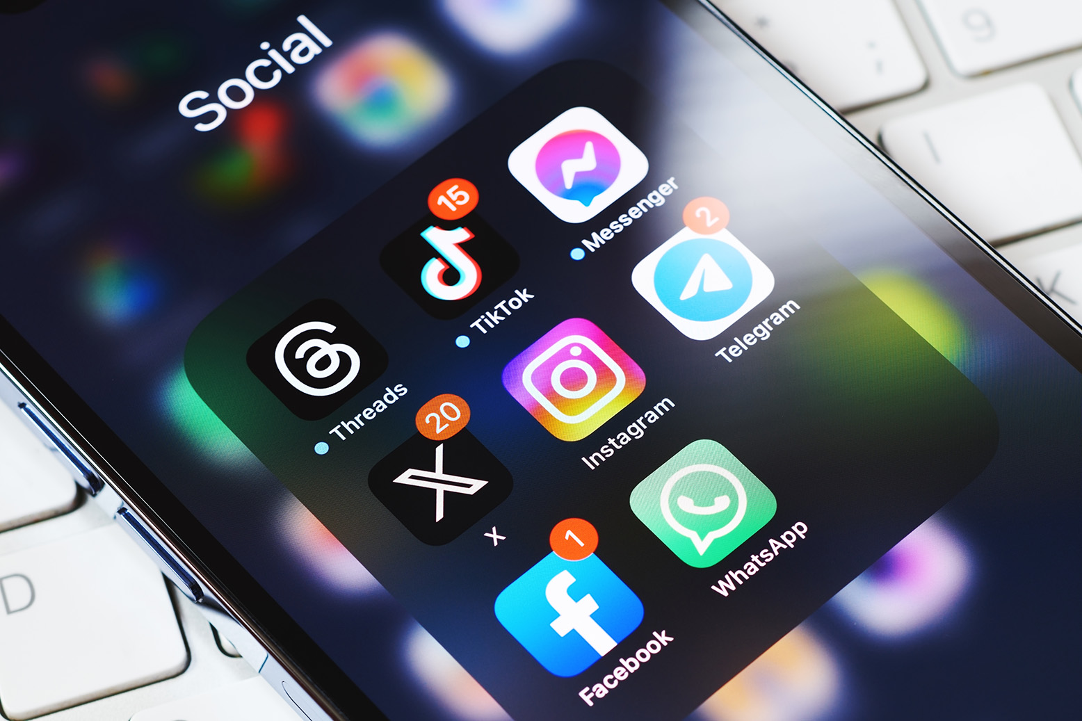 Social and messaging app icons on a smartphone screen
