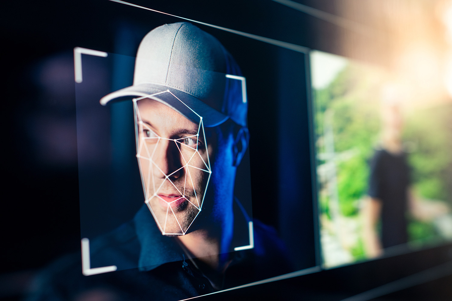 Face recognition grid over a person shown on a screen