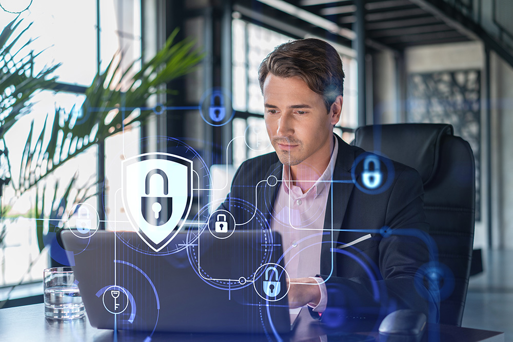 Person working at a laptop with a digital shield and lock overlay