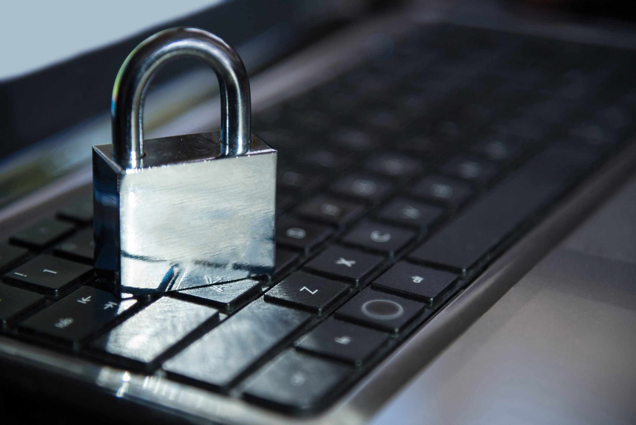 Metal padlock on a laptop keyboard
