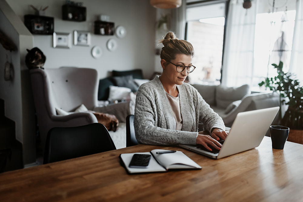 Person working on a laptop at home